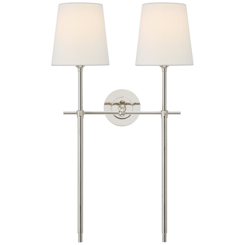 Elegant wall lamp for ambient light, featuring a soft fabric shade, enhances any interior.