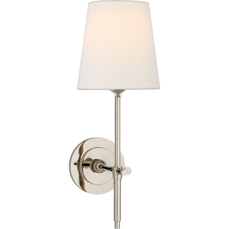 Wall mounted lamp with soft fabric shade, an elegant hardwired solution for ambient light.