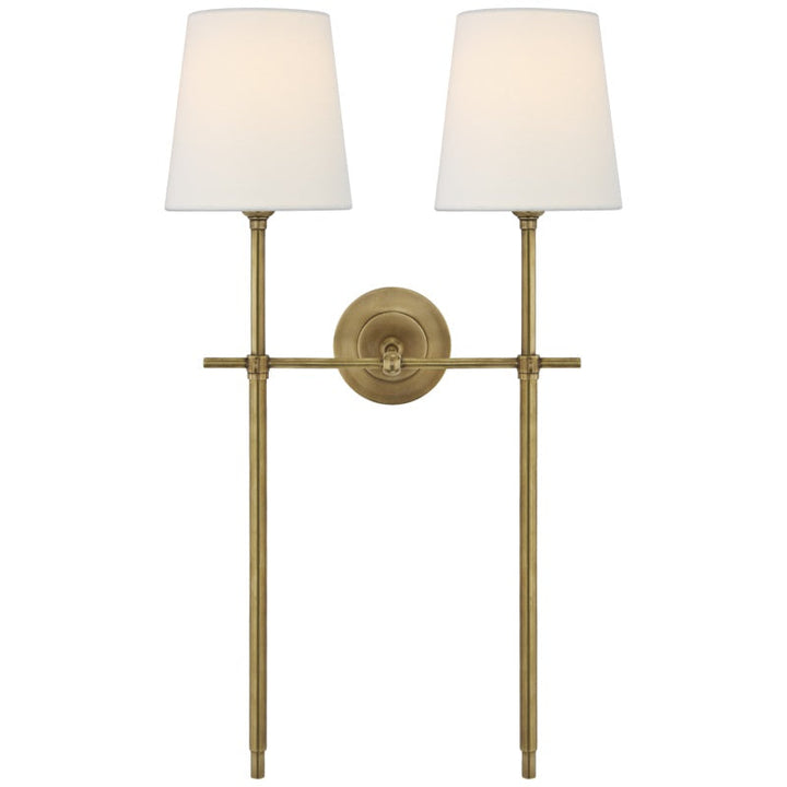 Accent wall lighting with a beautiful fabric shade, adding an elegant touch to rooms.