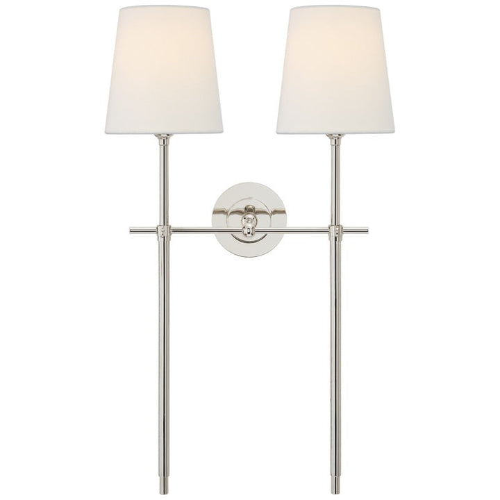 Hardwired fabric shade wall lamp, providing a welcoming ambient light for your home.