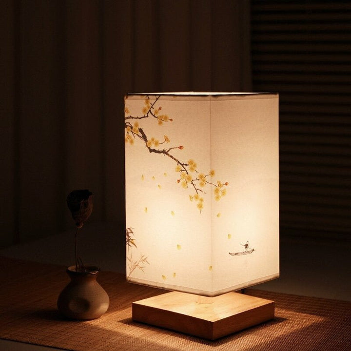 Decorative Japanese style table lamp with intricate floral print fabric shade; perfect Scandinavian home accent.