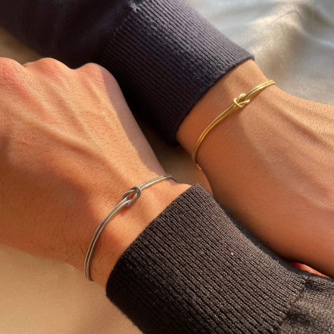 Elegant knot bracelet for women, subtle stainless steel design, perfect daily wear accessory.