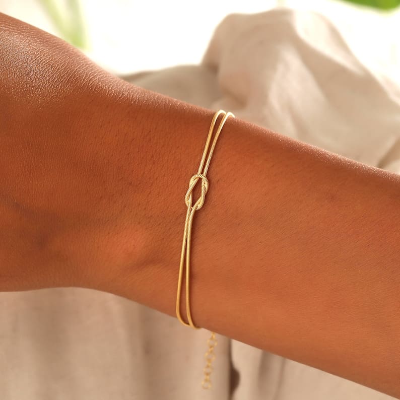 Elegant knot bracelet, perfect gift for her. Subtle stainless steel women's jewelry accessory.