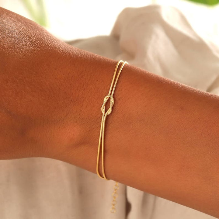Elegant knot bracelet, perfect gift for her. Subtle stainless steel women's jewelry accessory.