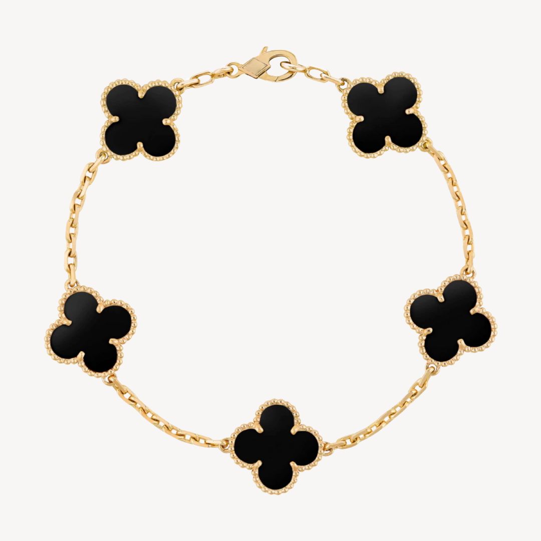 Elegant ladies' clover charm bracelet with delicate design, perfect women's accessory.