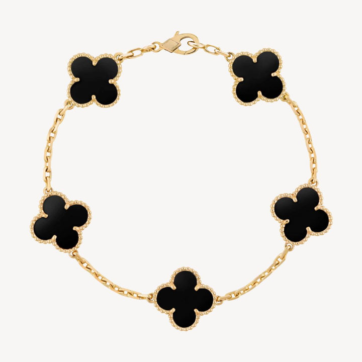 Elegant ladies' clover charm bracelet with delicate design, perfect women's accessory.
