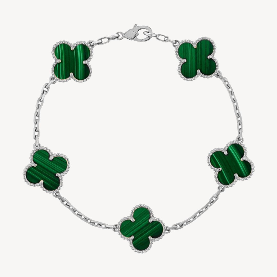 Dainty gold tone clover charm bracelet with colorful agate, an elegant accessory for women.