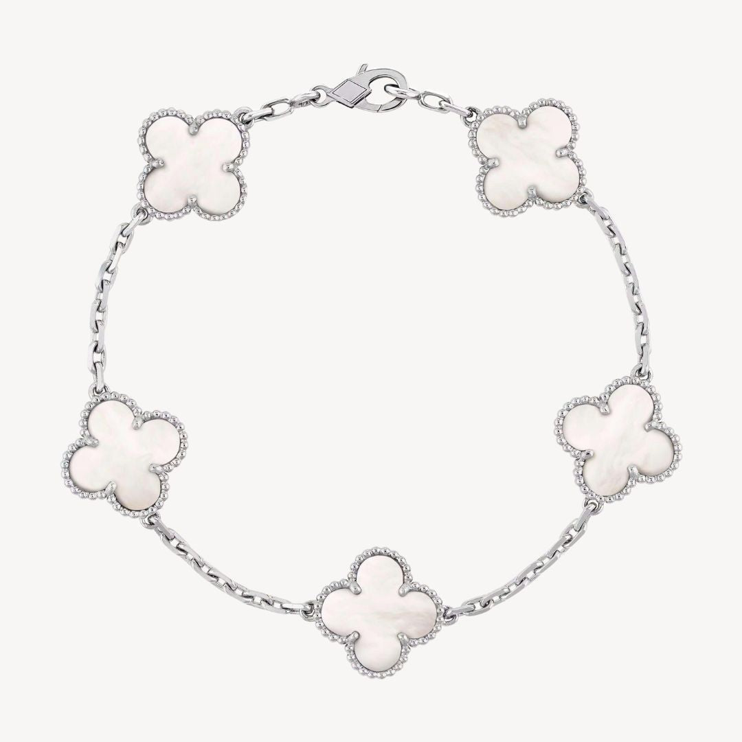 Elegant gold tone clover charm bracelet with agate stones, an ideal gift for ladies.