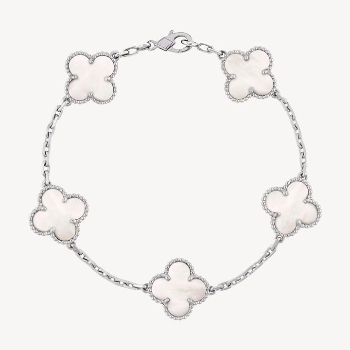 Elegant gold tone clover charm bracelet with agate stones, an ideal gift for ladies.