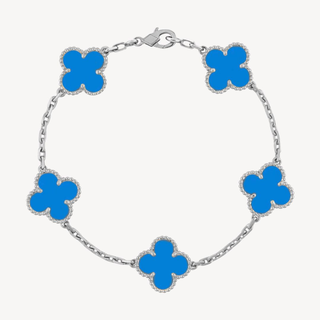 Ladies' elegant clover charm bracelet adorning a wrist, a chic and dainty fashion accessory.