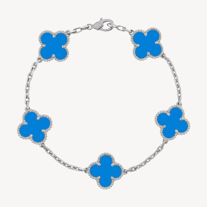 Ladies' elegant clover charm bracelet adorning a wrist, a chic and dainty fashion accessory.