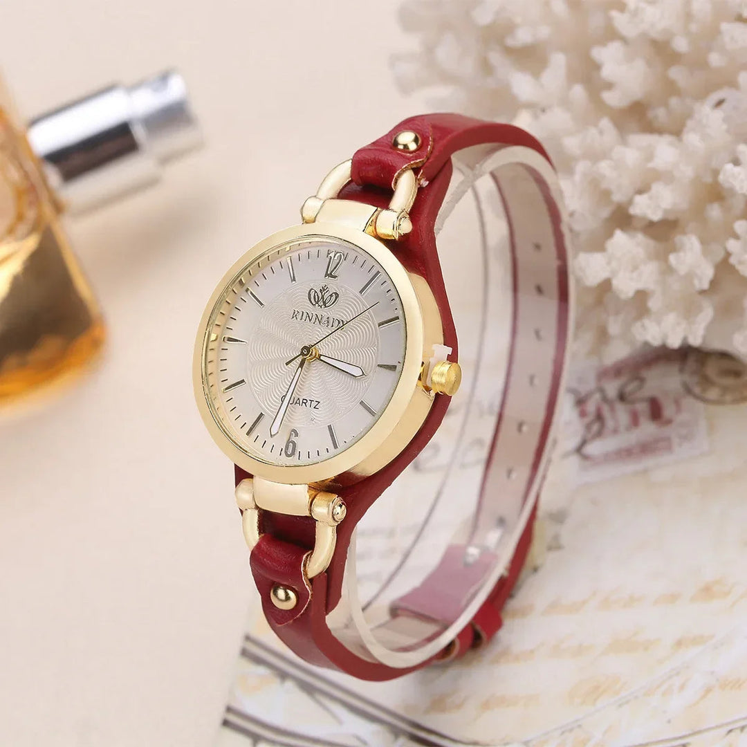 Fashionable ladies' watch with a detailed engraved face and comfortable brown vegan leather strap.