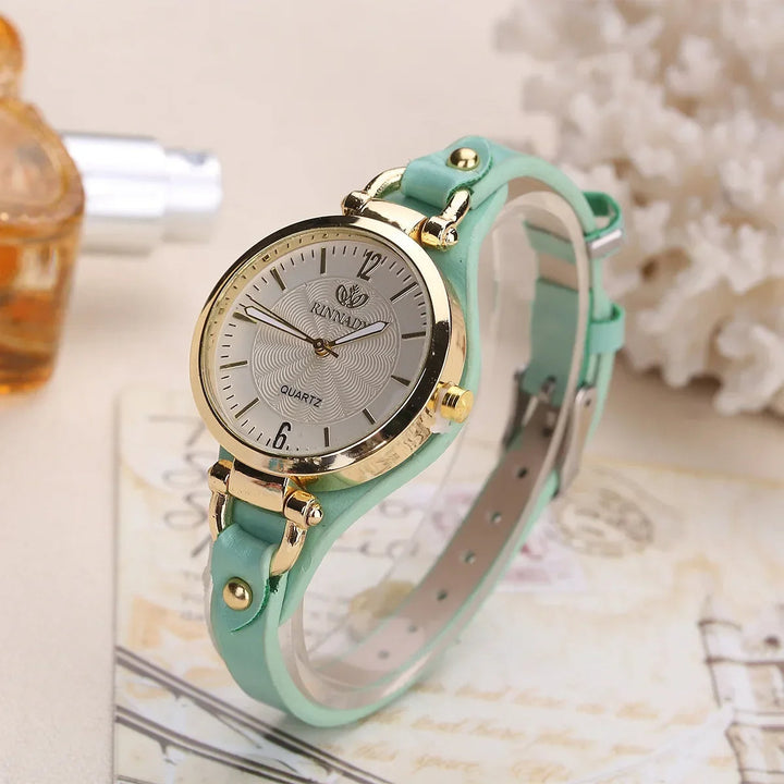 Timeless design ladies' quartz dress watch with a unique engraved dial and black vegan leather.