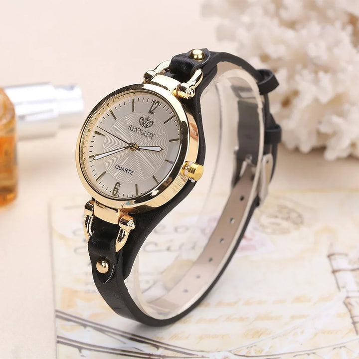 Beautiful ladies' quartz timepiece showcasing an elegant engraved pattern on the dial.