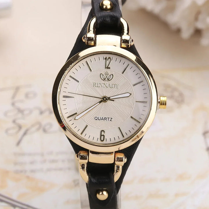 Showcasing a ladies' elegant quartz watch with a distinctive engraved dial and durable vegan strap.