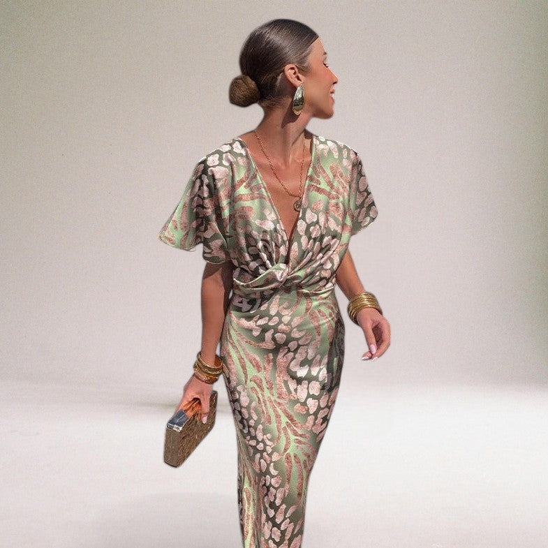 Beautiful light green elegant women's maxi dress featuring a V-neck, suitable for formal events & evening wear.