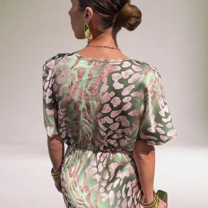 Women's elegant light green V-neck wrap maxi dress, a flowy gown for wedding guests & special occasion parties.