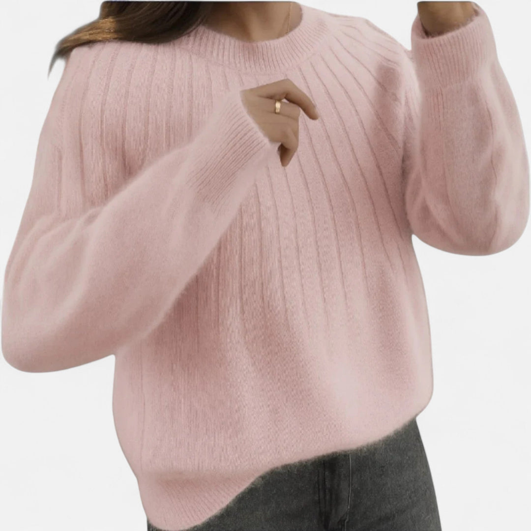 Elegant light pink women's timeless knit sweater, soft & comfortable long sleeve top for casual chic style.