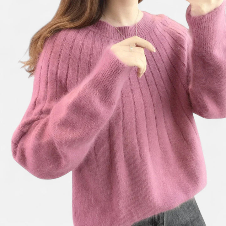 White timeless knit sweater for women, offering soft comfort and sophisticated long-sleeve style.
