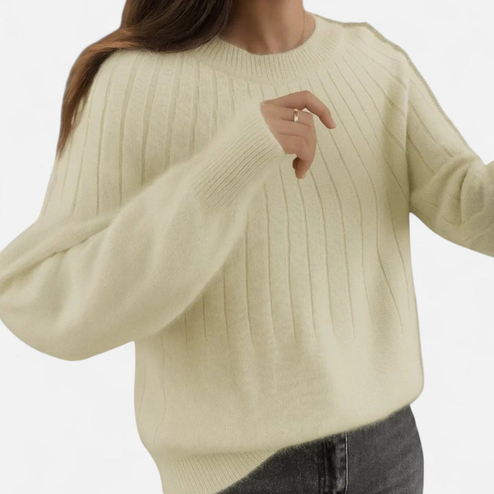 Brown women's elegant knit sweater. Comfortable long sleeve top, perfect for versatile, sophisticated wear.