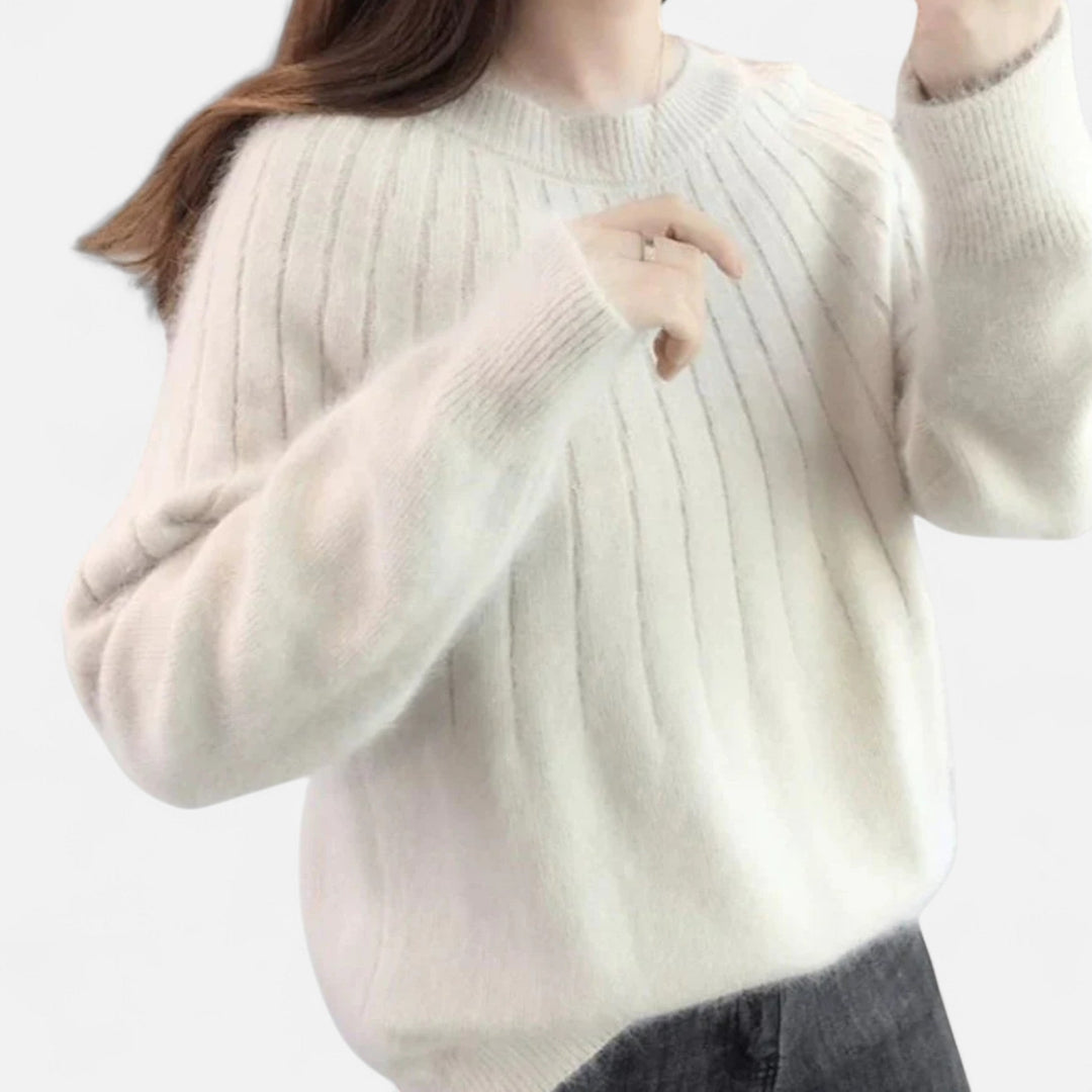 Soft & elegant women's timeless knit sweater, a comfortable long sleeve top for versatile, casual chic wear.