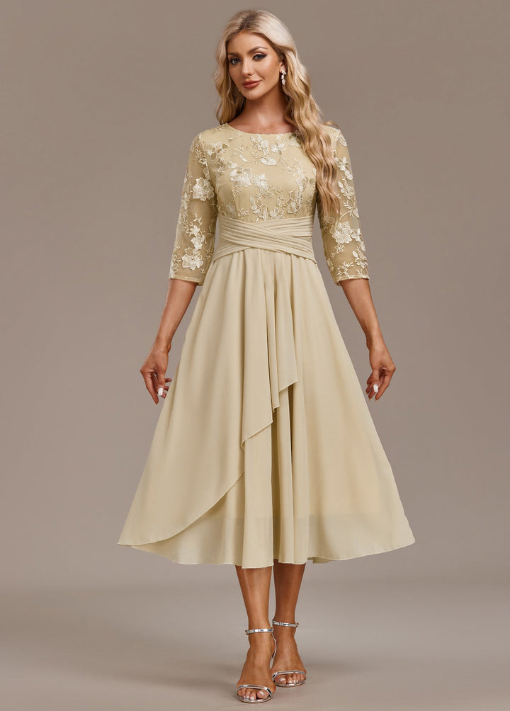 Beautifully embroidered light yellow midi dress for women, round neck, 3/4 sleeves; comfortable & stylish spring fashion.