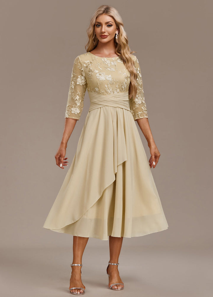 Stylish women's embroidered midi dress in light yellow, featuring a flattering fit, round neck, and 3/4 sleeves.