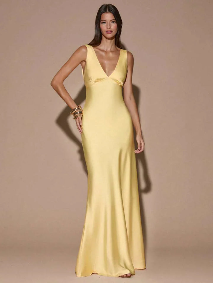 Elegant light yellow women's V-neck backless maxi evening dress, perfect formal gown for special occasions.