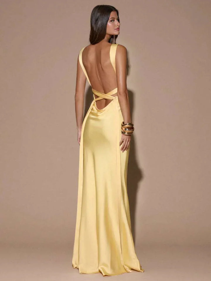 Chic light yellow women's maxi evening dress, V-neck backless formal gown with elegant mermaid hem for events.