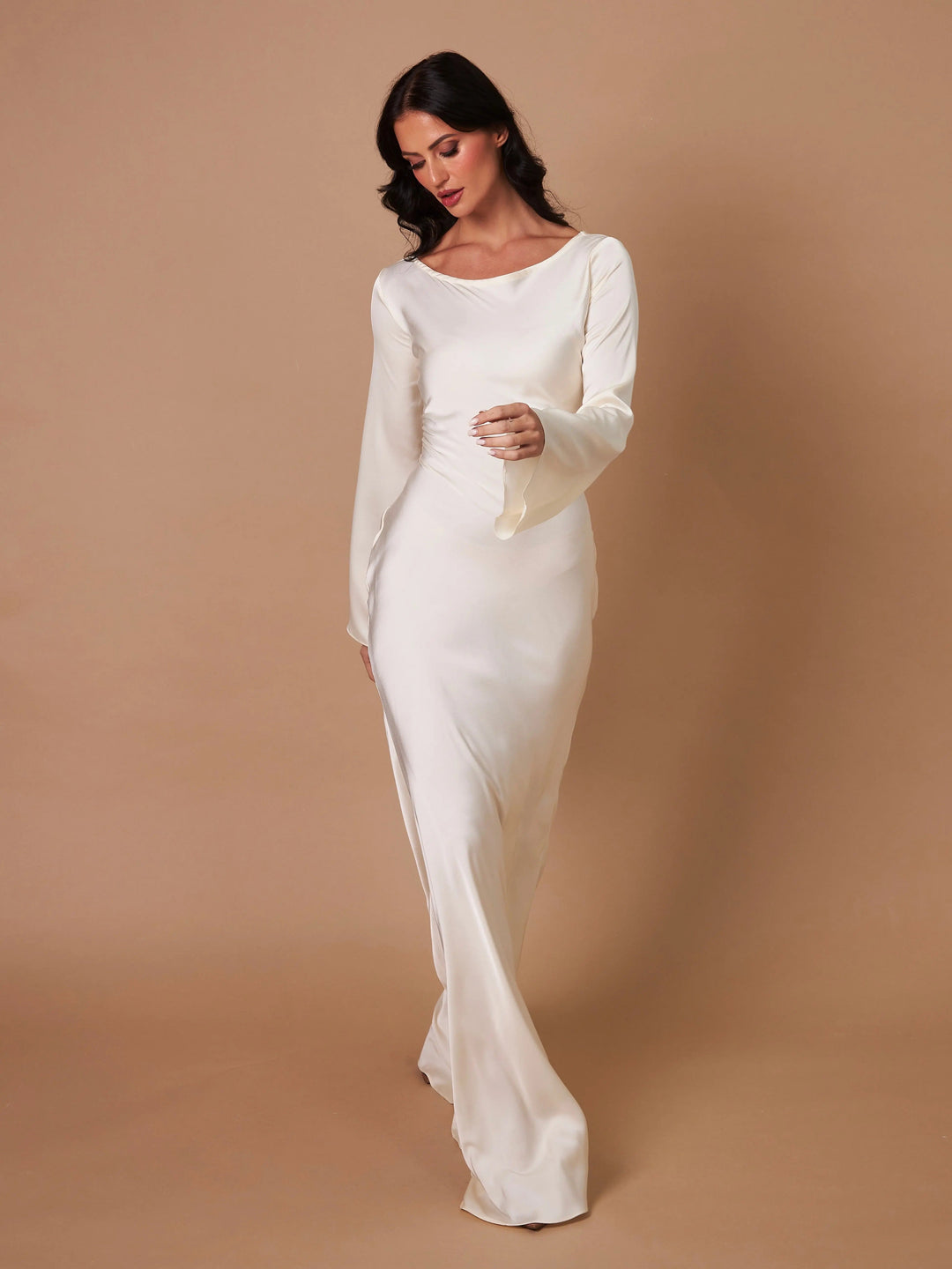 Floor-length evening gown with long sleeves, elegant design.