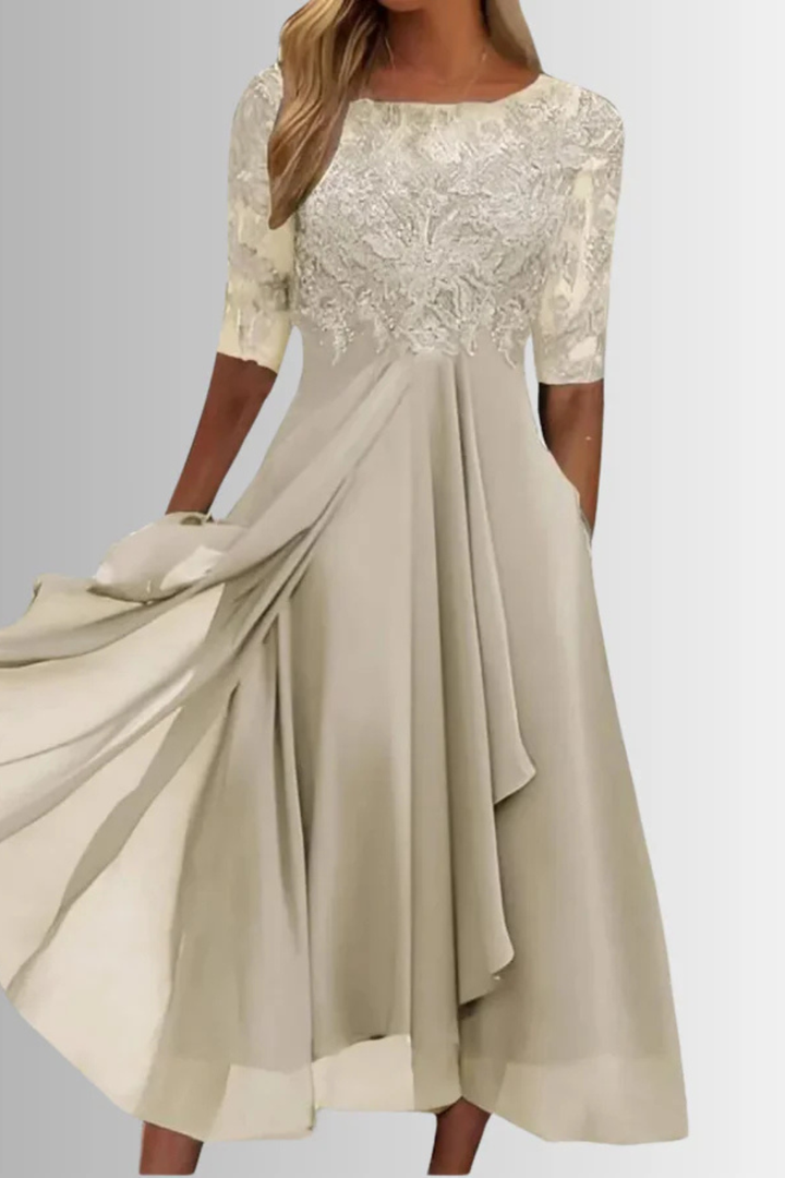 Modest and elegant long sleeve midi dress, perfect for a wedding guest or formal evening wear.