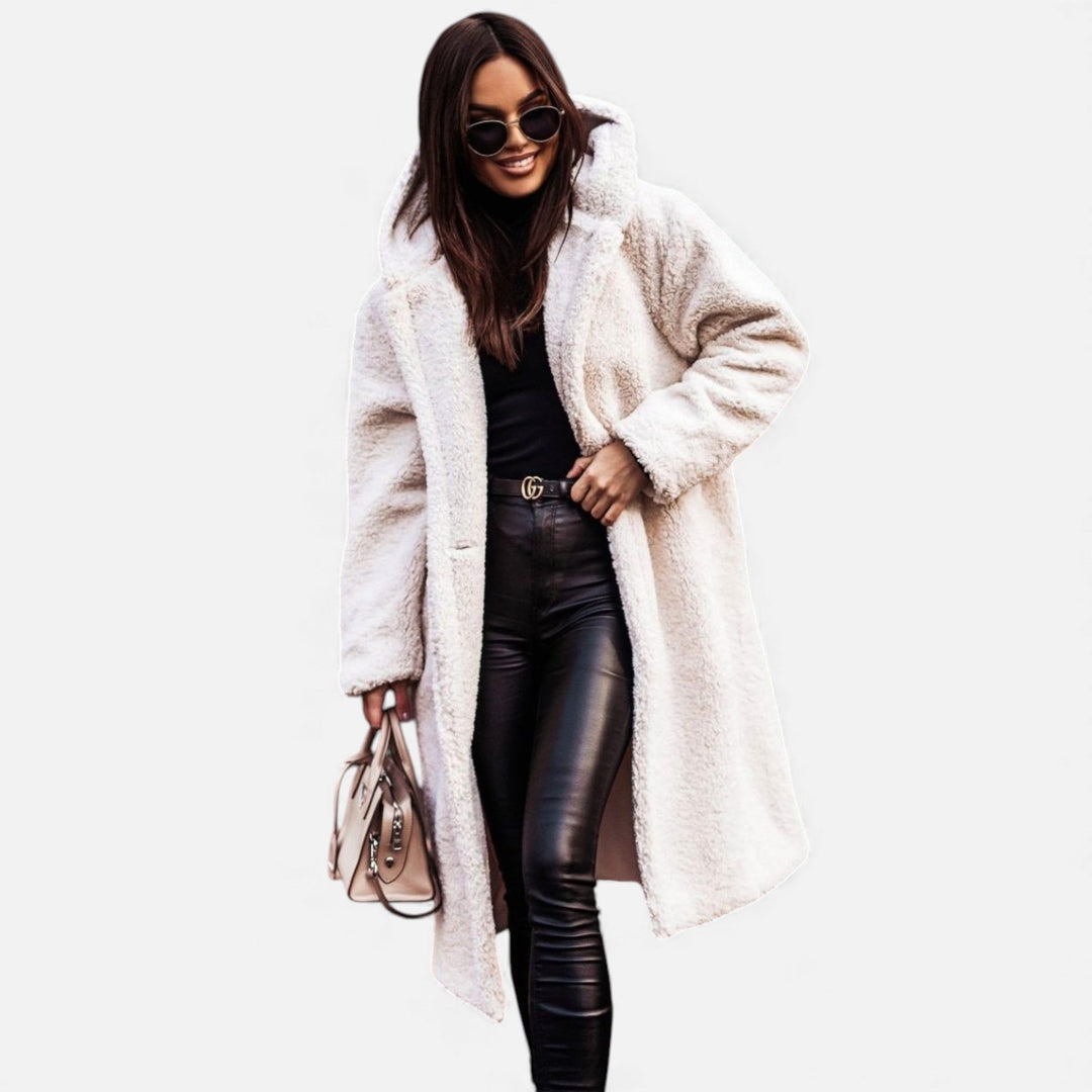 Elegant longline women's winter coat. Warm & stylish outerwear for sophisticated cold-weather fashion.