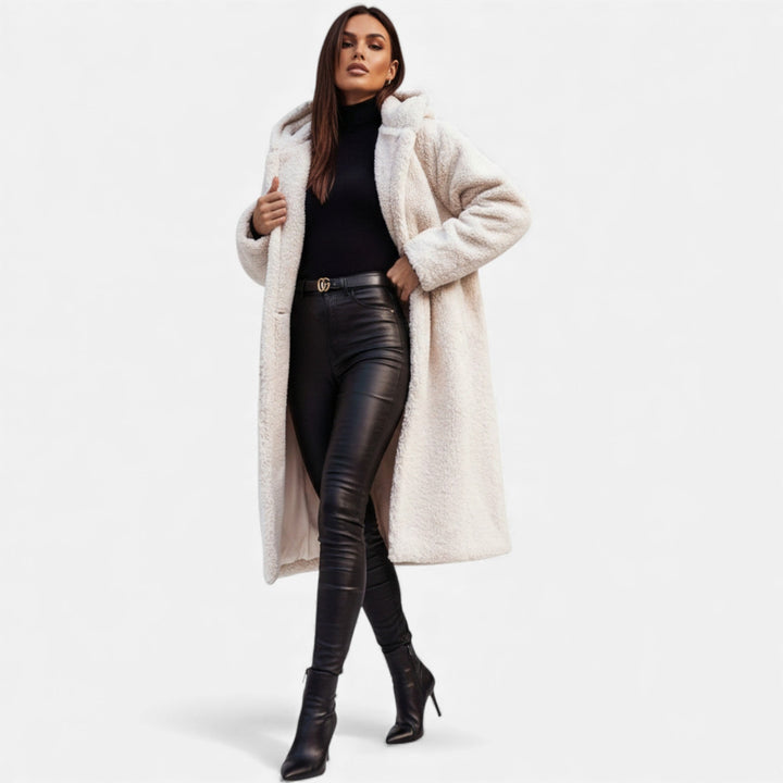 Warm & stylish women's longline winter coat. Elegant outerwear for cozy autumn and winter fashion.
