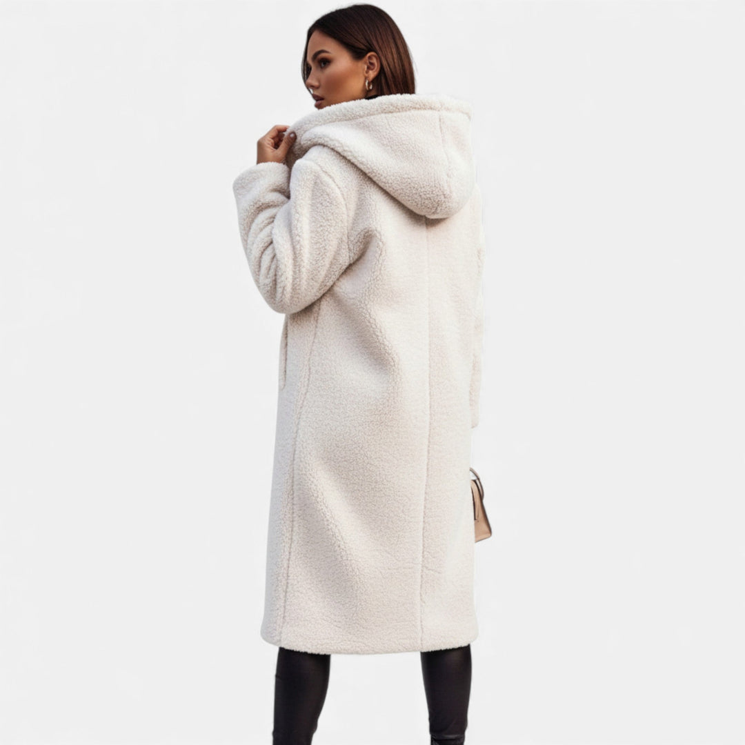 Cozy longline women's winter coat. Sophisticated & elegant outerwear, perfect for cold weather style.