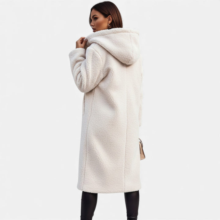 Cozy longline women's winter coat. Sophisticated & elegant outerwear, perfect for cold weather style.
