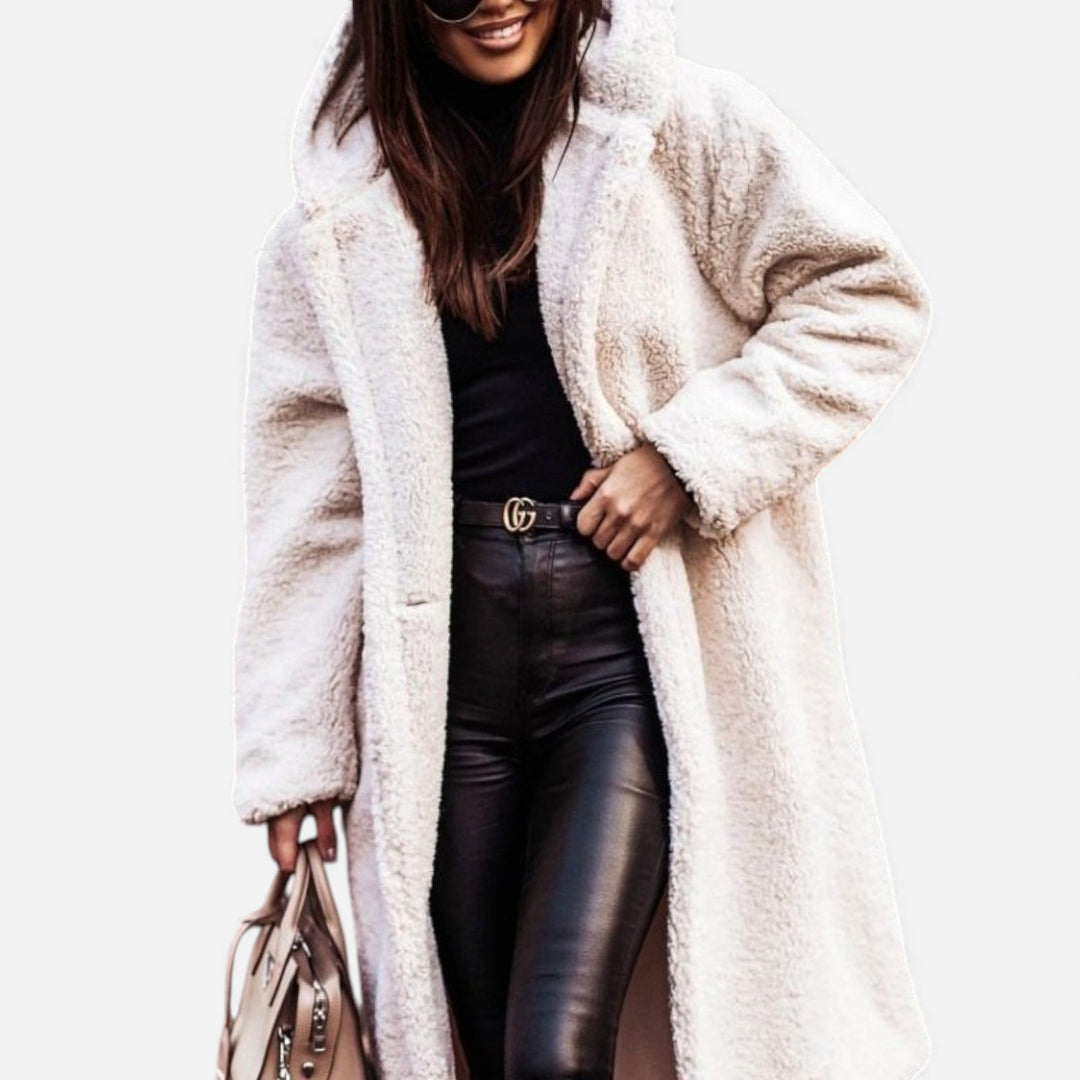 Sophisticated longline women's winter coat. Elegant & warm outerwear, ideal for stylish autumn fashion.