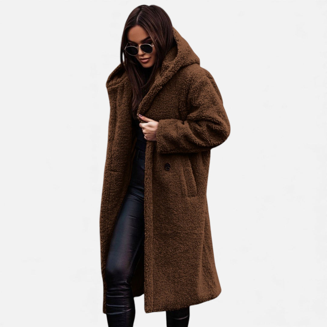 Women's elegant longline winter coat. Warm outerwear for sophisticated cold-weather fashion.