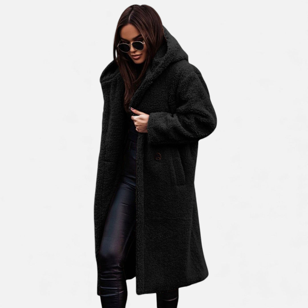 Elegant longline women's winter coat. Warm, cozy, and sophisticated outerwear for stylish cold weather.