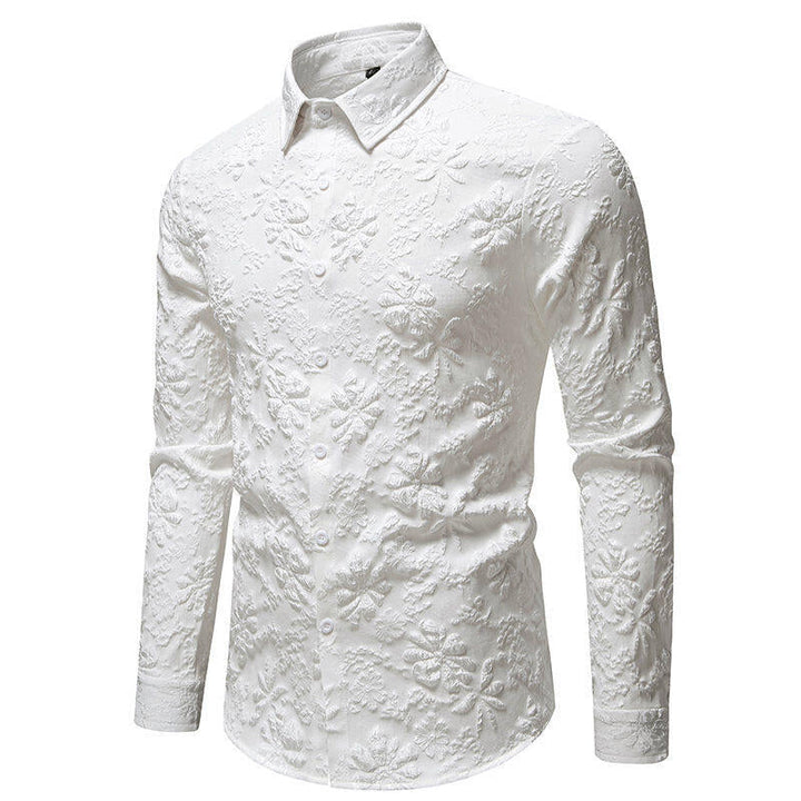 Close-up of men's button-up shirt featuring detailed floral embroidery pattern on the front. Unique design.