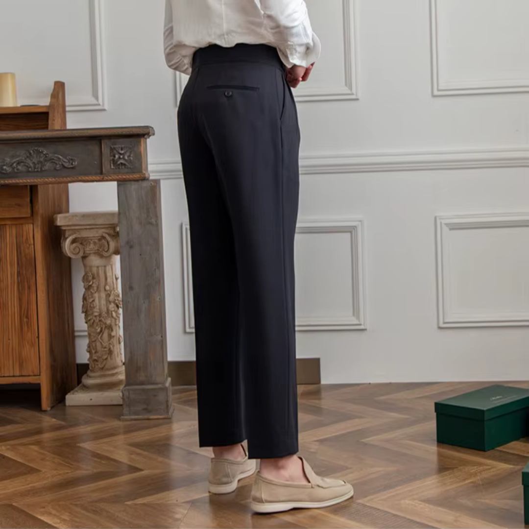 Back view of stylish men's pleated trousers, highlighting the modern high-waist design and comfort.