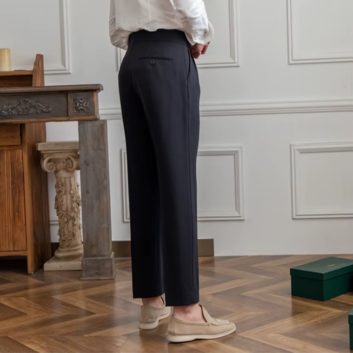 Back view of stylish men's pleated trousers, highlighting the modern high-waist design and comfort.