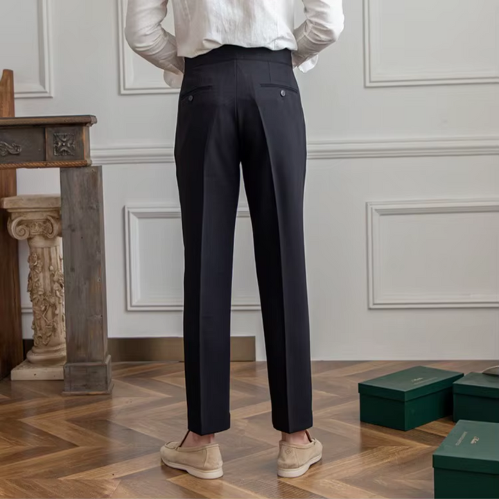 Man in comfortable pleated chino trousers, perfect for dynamic modern business casual style.
