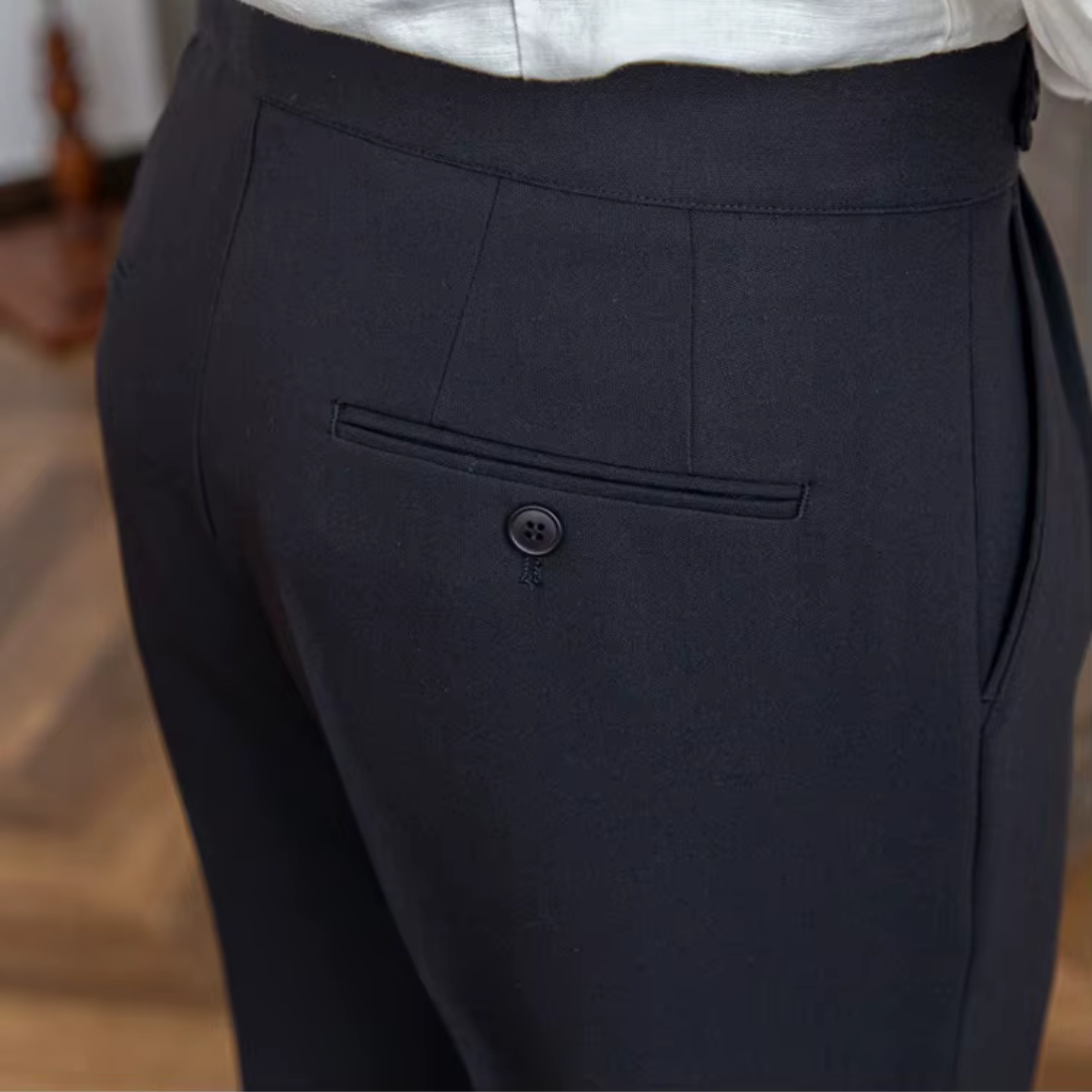 Detail of sharp pleats on men's elegant dress trousers, reflecting modern men's fashion trends.