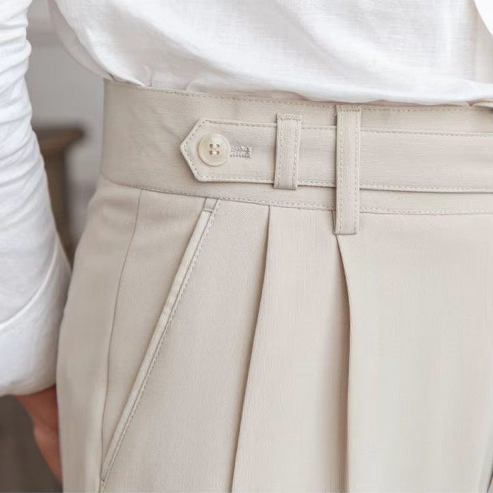 Smart men's pleated dress trousers for business casual settings, combining comfort and elegance.