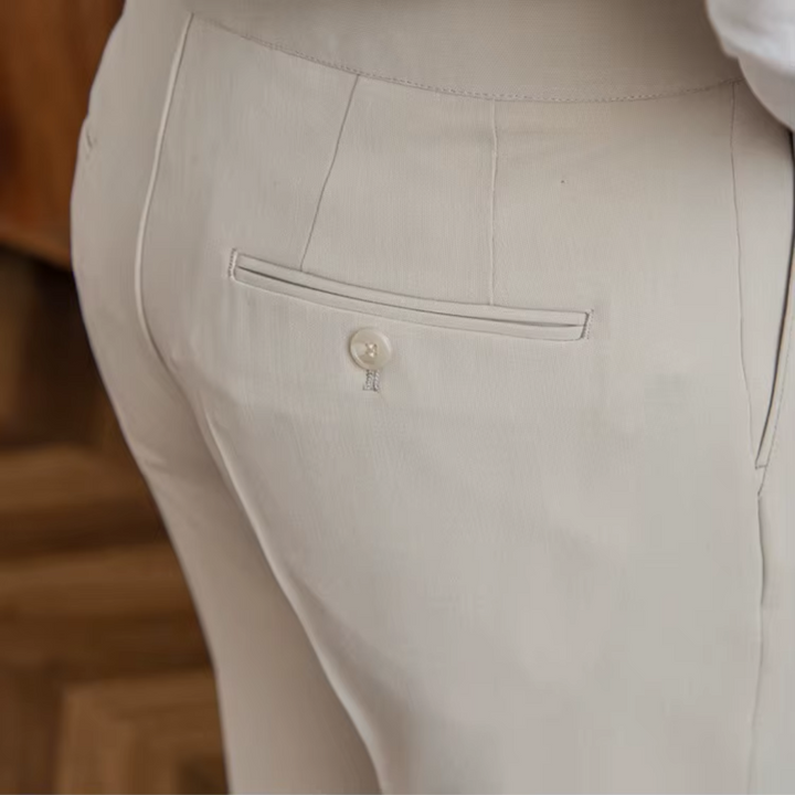 Close-up of elegant men's pleated trousers fabric, showcasing modern style & premium quality.