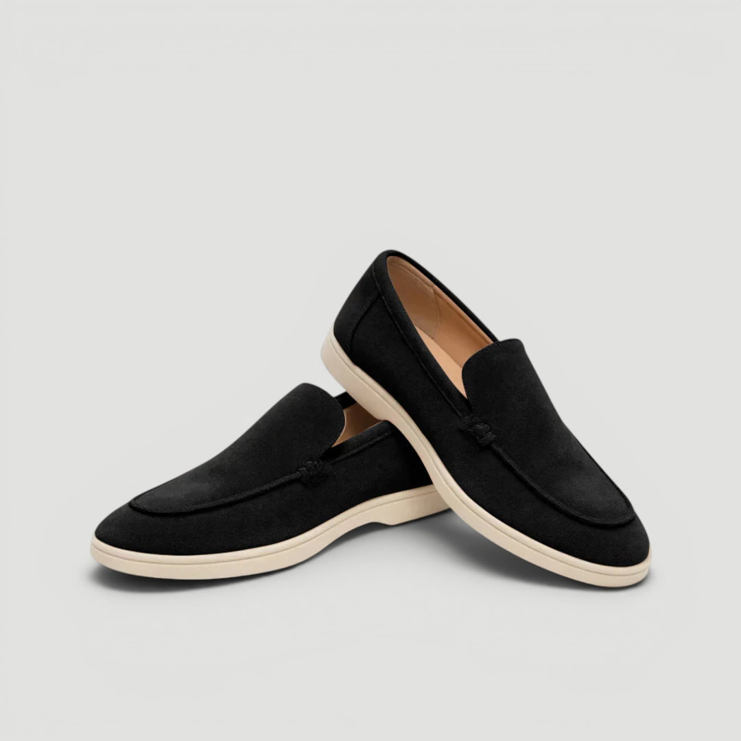 Side profile of men's fashionable loafers, showcasing the sleek design & comfort for warm weather.