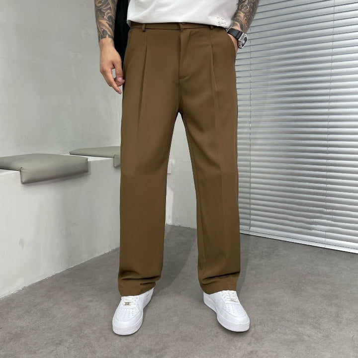 Elegant men's wide-leg dress trousers with a sharp pleated front for sophisticated formal or smart casual wear.