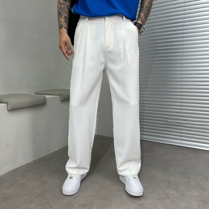 Smart men's wide-leg dress pants featuring a classic pleated front, offering a comfortable, relaxed yet refined fit.
