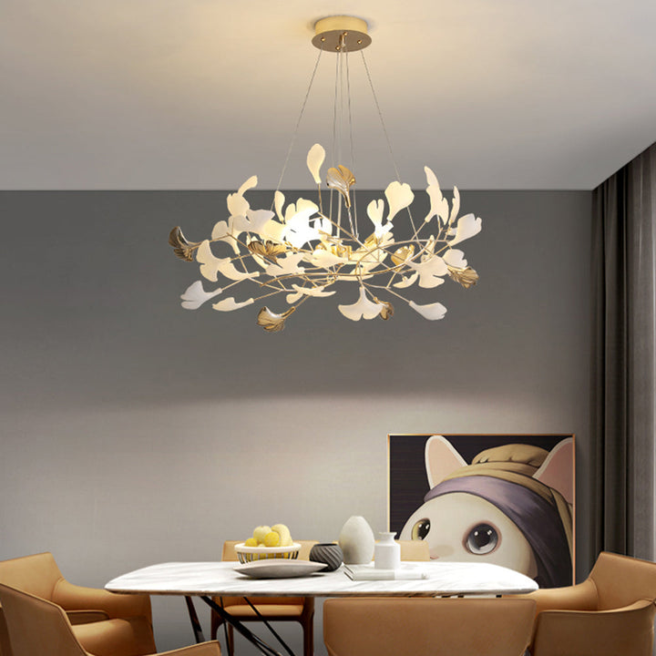 Decorative Merrlian chandelier, gold & white, brings modern elegance to dining areas.