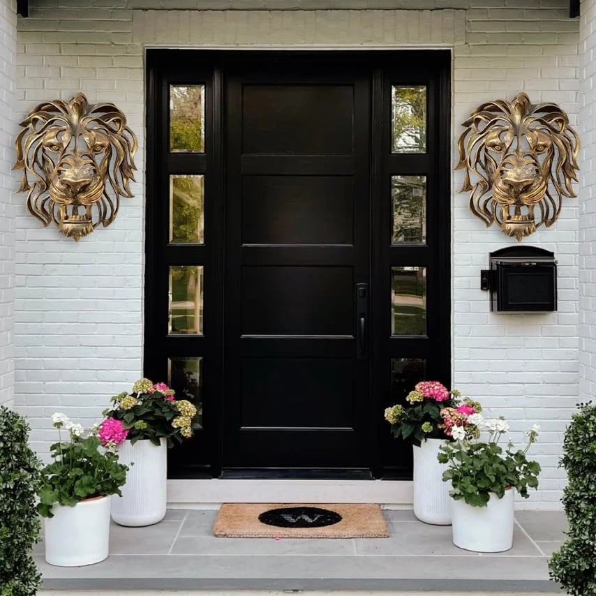 Majestic metal lion head, an impressive piece of wall art for a grand entrance.
